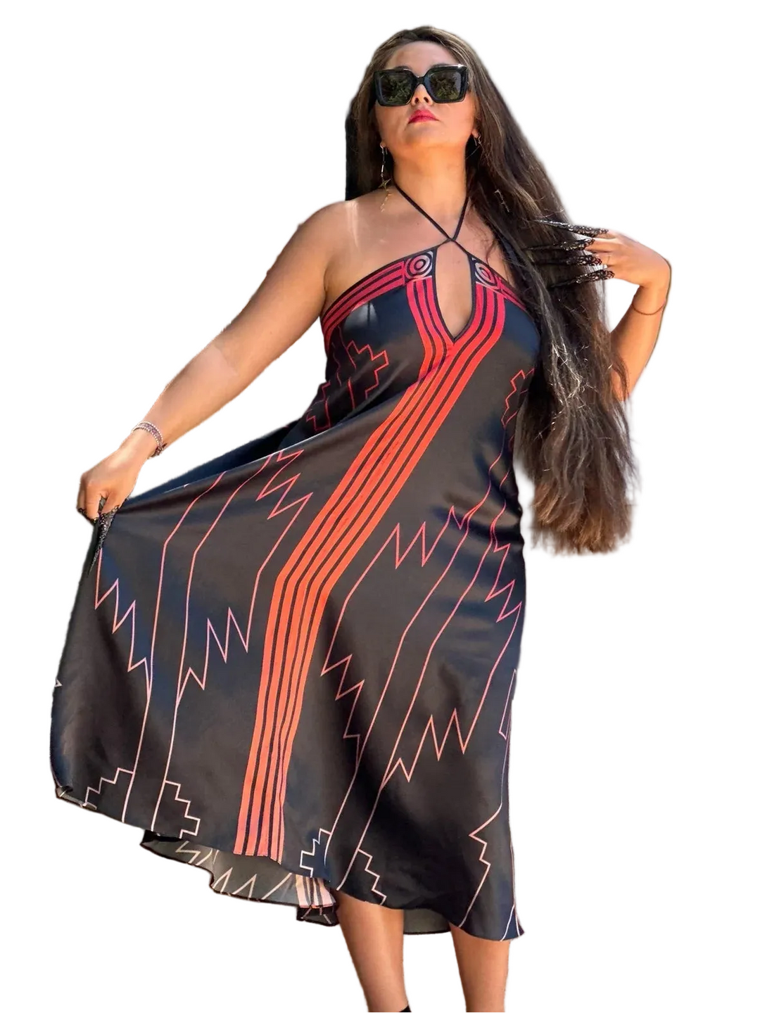 Woman wearing a black dress with red and blue patterns on a white background