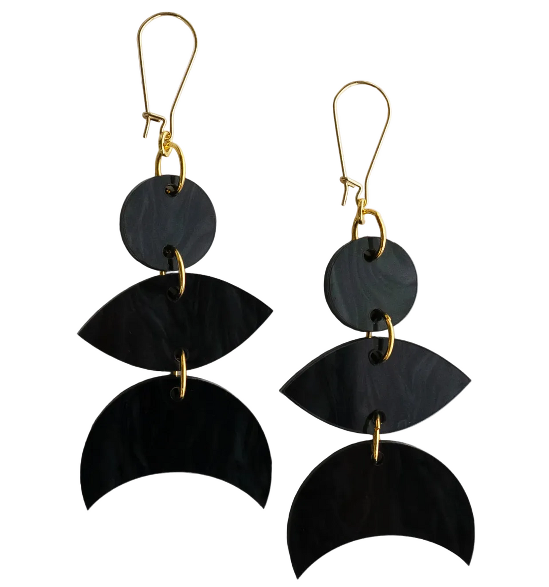 Black layered earrings with gold hooks on a white background