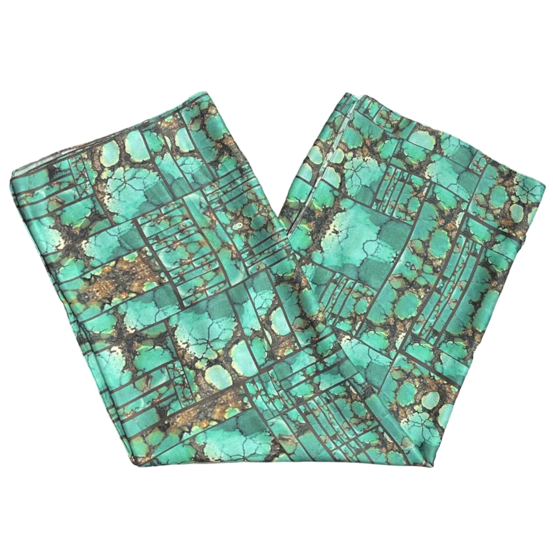 Native Turquoise patterned scarf on a white background