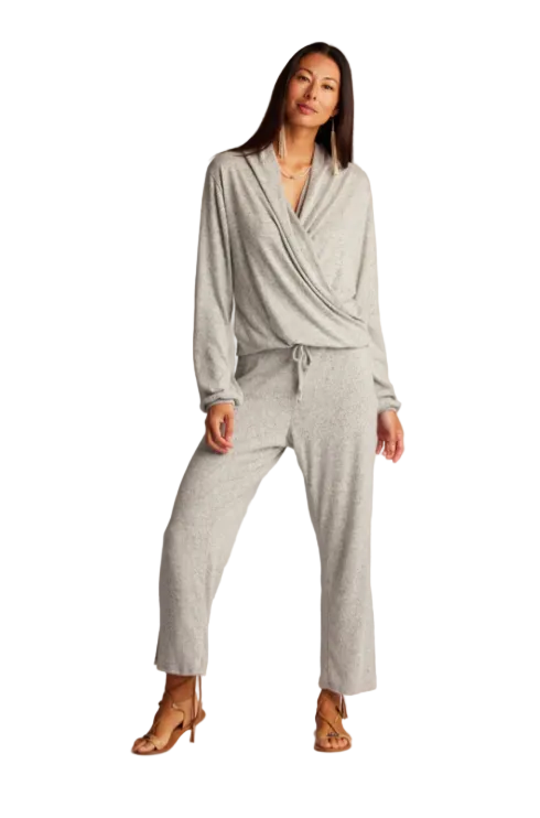 Woman wearing a gray Native American outfit on a white background