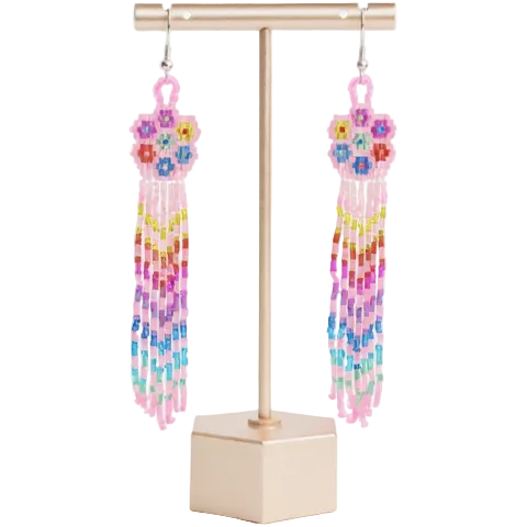 Colorful beaded earrings on a gold stand against a white background