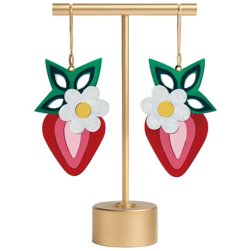 Colorful strawberry-shaped earrings with floral designs on a gold stand against a white background