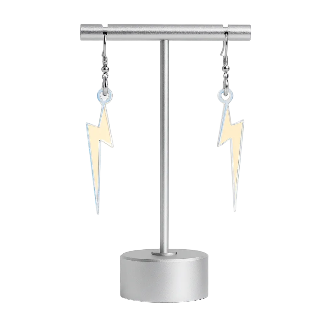 Pair of lightning bolt earrings on a stand against a white background